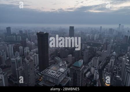 Aerial View of business area and cityscape in foggy dawn, West Nanjing road, Jing`an district, Shanghai Stock Photo